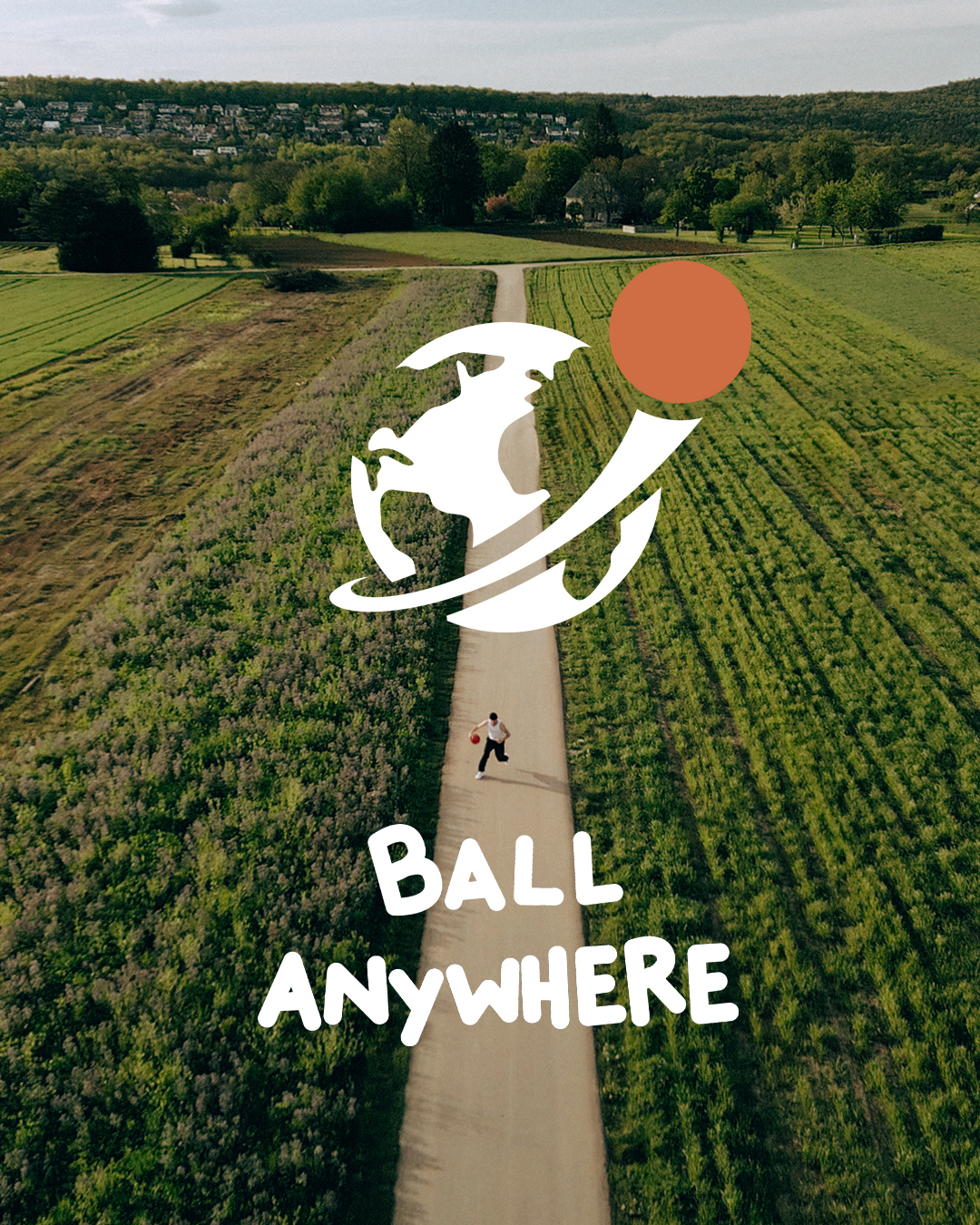 Man dribbling a ball somewhere in a field