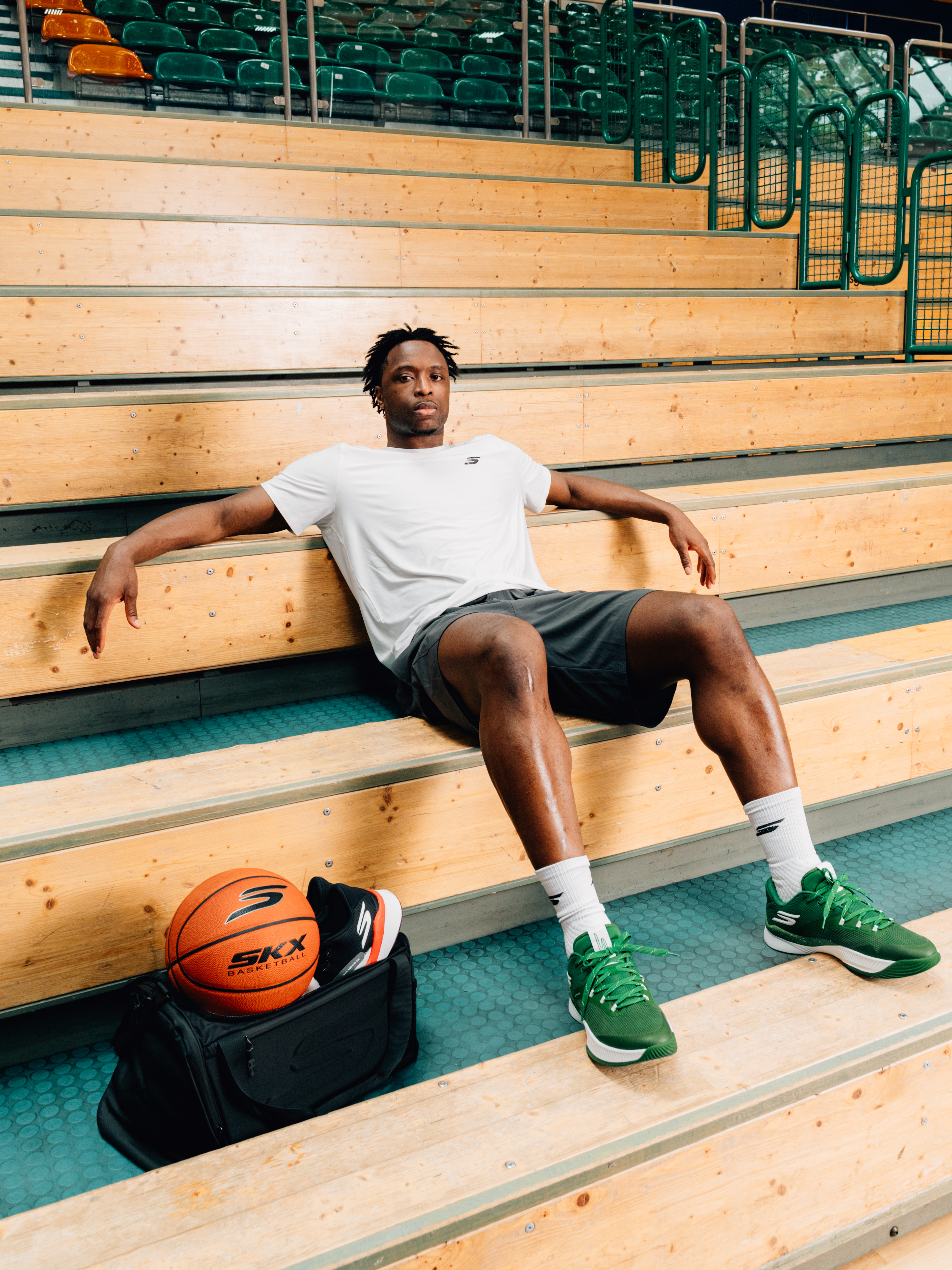 A couple puts a parcel in a locker.