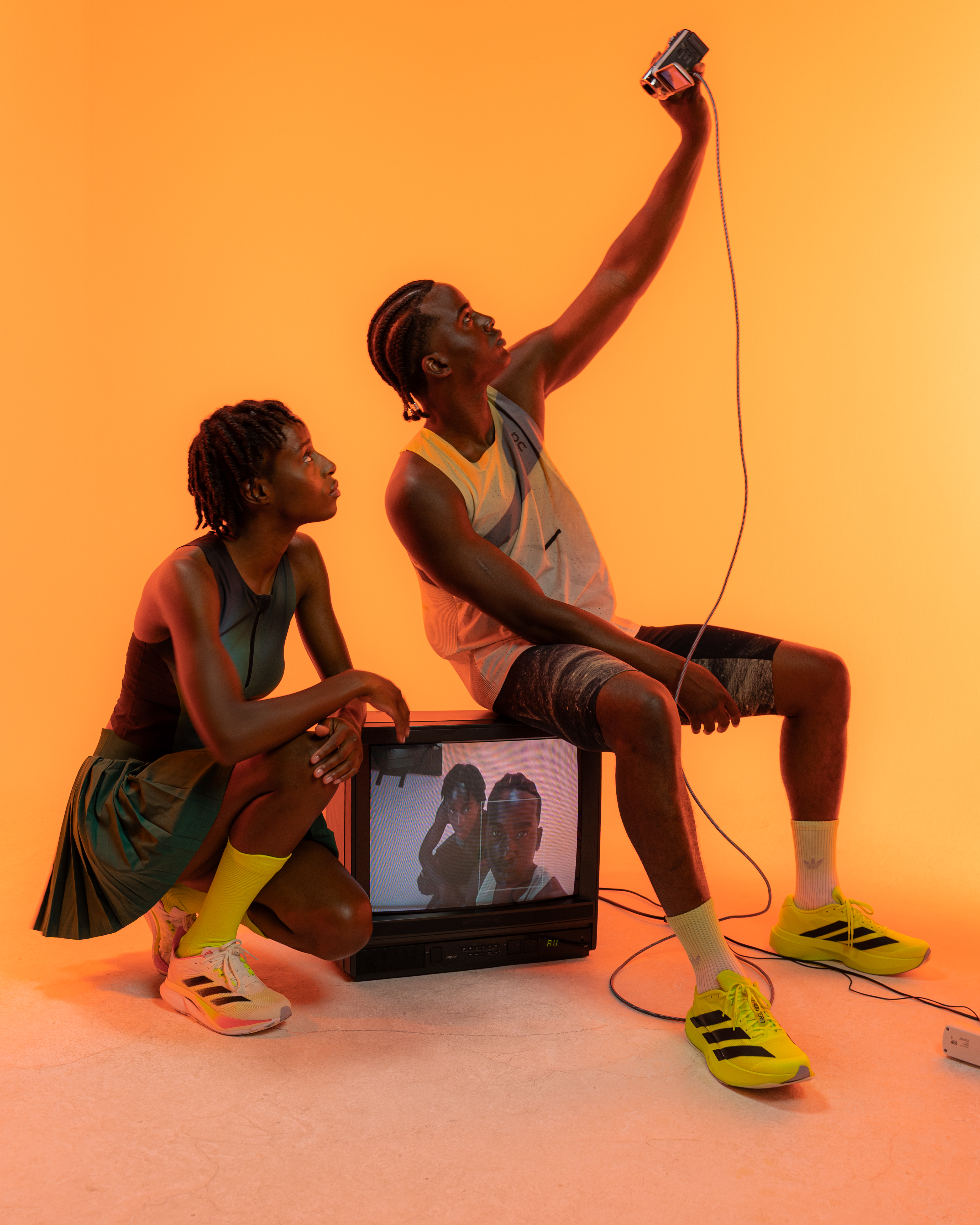 A couple puts a parcel in a locker.