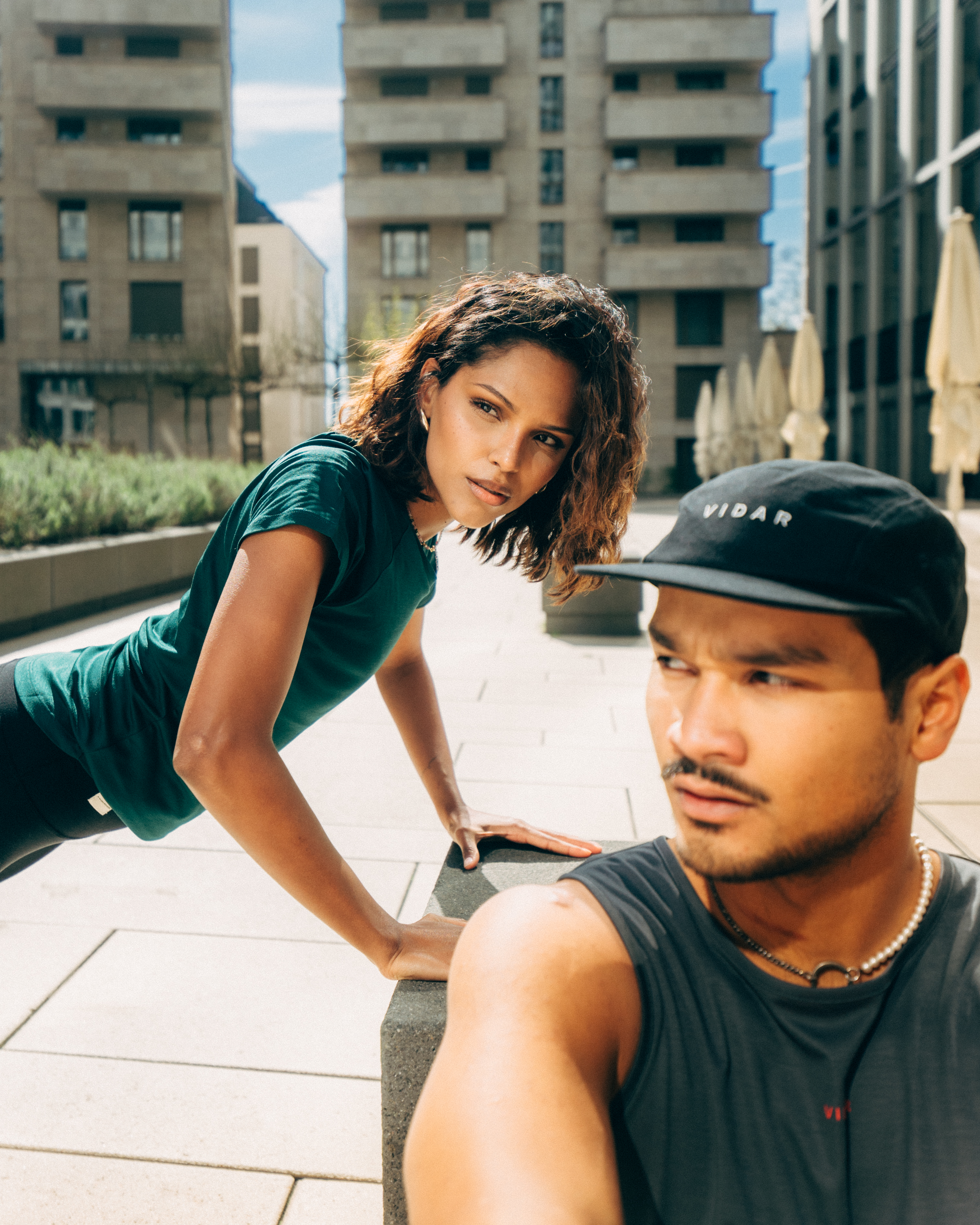 A couple puts a parcel in a locker.